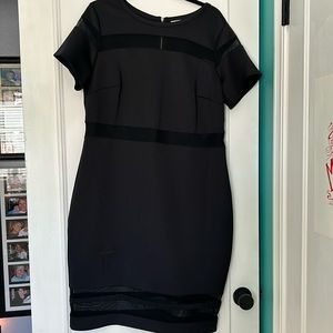 Black dress…with see thru details in sleeve and at the bottom